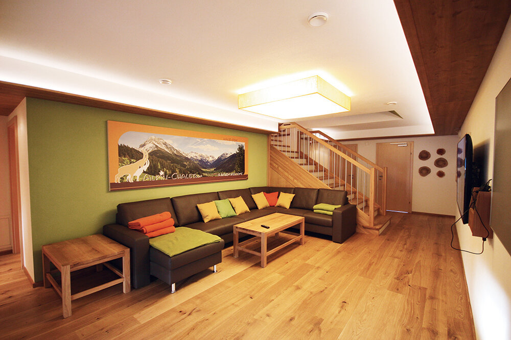 The Alpin Atrium with couch corner in the Alpin Chalet Large in Filzmoos.