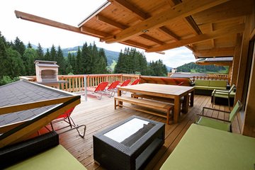 Private sun terrace with brick BBQ in Alpin Chalet XL in Wagrain.