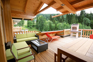 Private sun terrace with brick BBQ in Alpin Chalet XL in Wagrain.