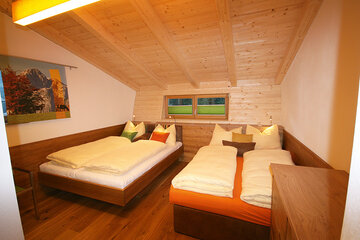 Bedroom for 4 persons in the Alpin Chalet Large in Filzmoos.