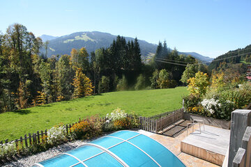 View from the sun terrace by the communal pool at the Alpin Chalets XL in Wagrain.